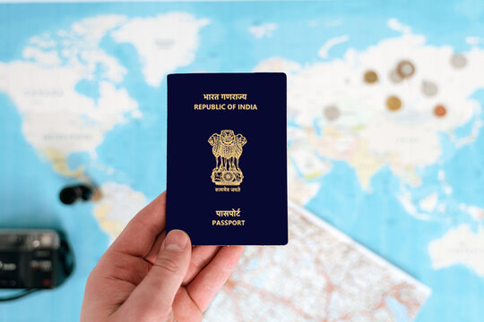 Indian Passport holding in hand