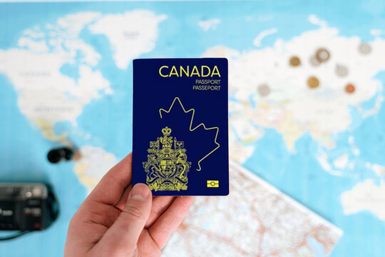 Canada Passport holding in hand