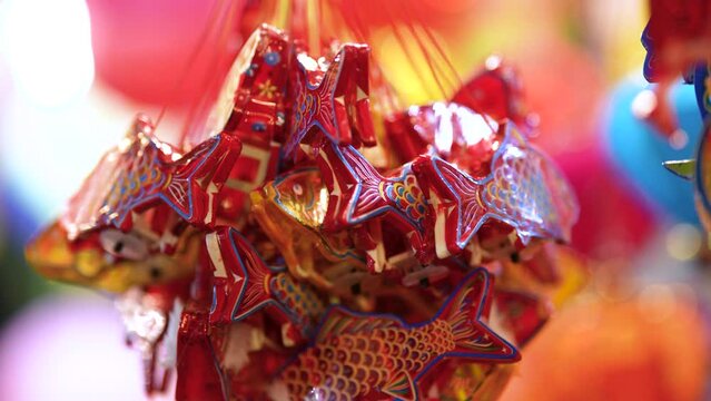 Decorated colorful lanterns hanging on a stand in the streets in Ho Chi Minh City, Vietnam during Mid Autumn Festival.