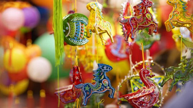 Decorated colorful lanterns hanging on a stand in the streets in Ho Chi Minh City, Vietnam during Mid Autumn Festival.