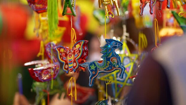 Decorated colorful lanterns hanging on a stand in the streets in Ho Chi Minh City, Vietnam during Mid Autumn Festival.
