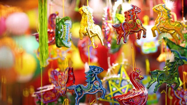 Decorated colorful lanterns hanging on a stand in the streets in Ho Chi Minh City, Vietnam during Mid Autumn Festival.