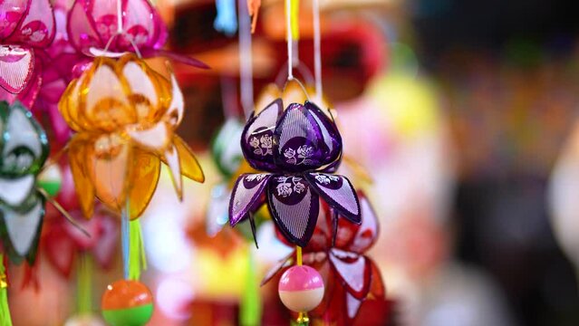 Decorated colorful lanterns hanging on a stand in the streets in Ho Chi Minh City, Vietnam during Mid Autumn Festival.