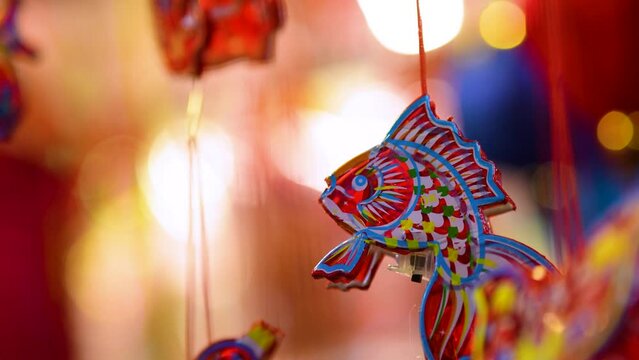Decorated colorful lanterns hanging on a stand in the streets in Ho Chi Minh City, Vietnam during Mid Autumn Festival.