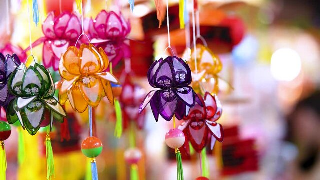 Decorated colorful lanterns hanging on a stand in the streets in Ho Chi Minh City, Vietnam during Mid Autumn Festival.