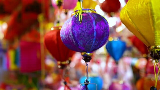 Decorated colorful lanterns hanging on a stand in the streets in Ho Chi Minh City, Vietnam during Mid Autumn Festival.