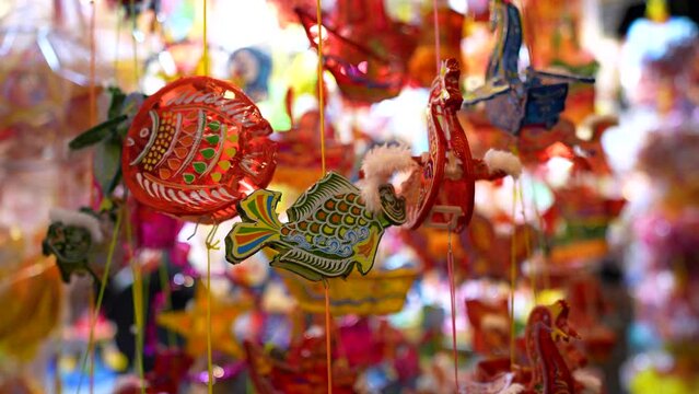 Decorated colorful lanterns hanging on a stand in the streets in Ho Chi Minh City, Vietnam during Mid Autumn Festival.