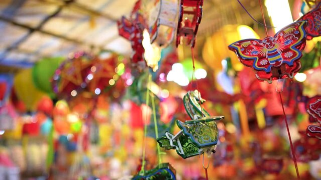 Decorated colorful lanterns hanging on a stand in the streets in Ho Chi Minh City, Vietnam during Mid Autumn Festival.
