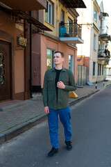 A man in casual clothes along the street