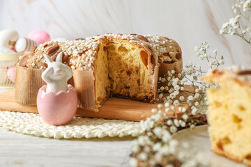 Delicious Italian Easter dove cake (traditional Colomba di Pasqua) and festive decor on white...