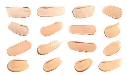 Set of foundation samples in different tones on white background