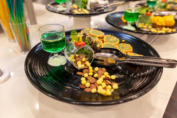 Roasted vegetables and raisins in a plate in a restaurant