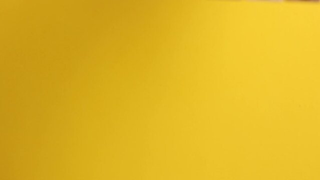 the word natural is written on wooden cubes, on a yellow background