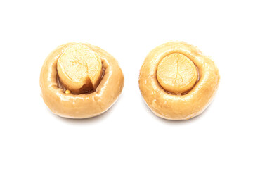 Pickled champignons isolated on a white background.