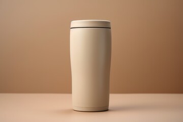 Beige aluminum mug on a beige background with a place for a logo, inscription or text.generative ai
