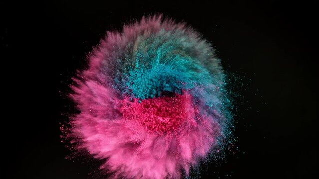 Super Slow Motion of Colored Powder Rotation in Reverse Speed Isolated on Black Background. Filmed on High Speed Cinema Camera, 1000fps.
