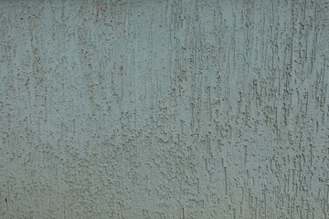 Background - dusty faded blue wall with stucco worm finish