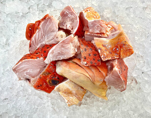 fresh raw cold seafood seven star whole fish ikan head, fillet, meat, cut, tail on white ice...