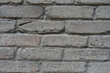 Closeup of old grey brick wall (front view)