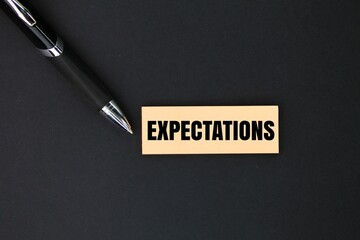 Colored pen and paper with the word Expectations. a strong belief that something will happen or be the case. - obrazy, fototapety, plakaty