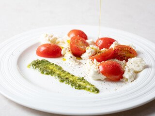 Cherry tomato salad with cheese on a plate