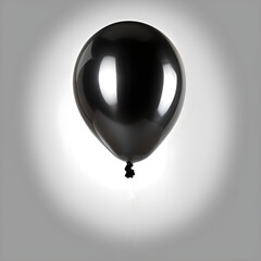 Black balloon on gray background.