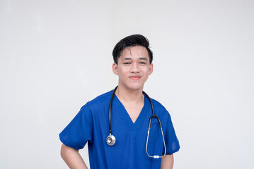 Portrait of a young and skilled medical student, nurse, intern posing while smiling at the camera. Isolated on a white background.