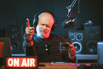 Radio host listening to music