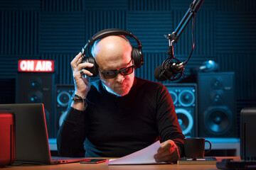 Professional radio host working in the studio
