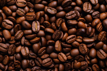 Fototapeta premium Background of roasted fresh brown coffee beans, perfect for a cool wallpaper