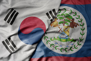 big waving national colorful flag of south korea and national flag of belize .