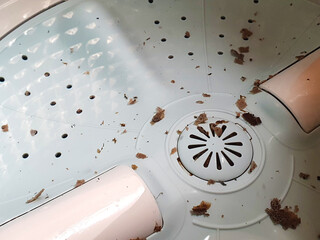 Dirt in the drum on the top load washing machine