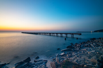 long exposure of old and abandoned pier. Beautiful sunset and light in Filyos beach of in Zonguldak    