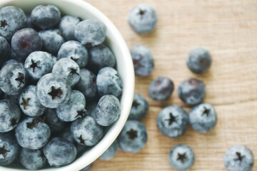 fresh blueberry purple fruit arranging in cup on table