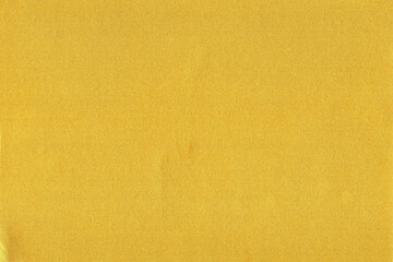 Scanned sheet of gold color paper with shimmer effect texture