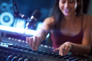 Sound engineer setting up a mixer