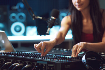 Musician setting up an audio mixer