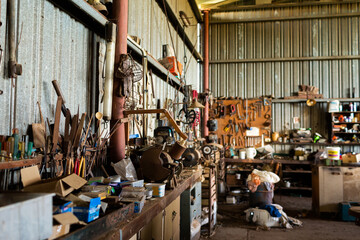 Rusted old tools in rural farm shed still in use