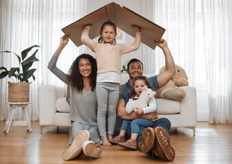 Parents, children and cardboard roof in portrait, smile or excited for security, real estate or...
