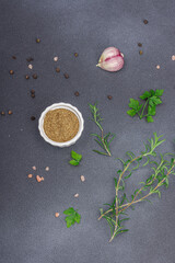Culinary background with spices and fresh herbs. Garlic, rosemary, sea salt, black peppercorn