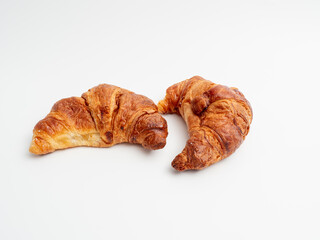 Croissant on a white background. Baked goods croissant close-up.