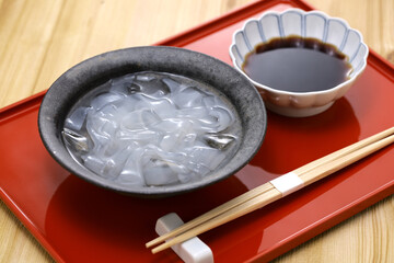 Kudzu Kiri (Japanese arrowroot starch noodles with brown sugar syrup) is a Japanese popular summer dessert.