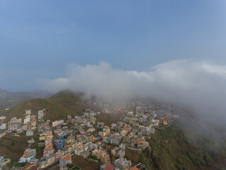 Obraz premium Aerial photos of Assomada in Santiago Island, Cabo Verde, reveal the vibrant culture, colorful markets, and stunning mountain landscapes of this historic town. The bird's-eye view captures the essence