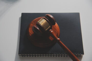 Business and lawyers discussing contract papers with brass scale on desk in office. Law, legal services, advice, justice and law concept picture with film grain effect