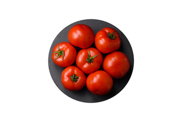 Delicious fresh juicy tomatoes on a dark concrete background
