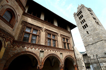Obraz premium The collegiate church of Santi Pietro e Orso is a Romanesque religious complex in Aosta; the bell tower and the ancient cloister are beautiful in Aosta Valley.