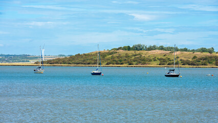 Boats / Yachts  in the Swale Estuary taken from Oare near Faversham - Kent with the Isle of Sheppey...