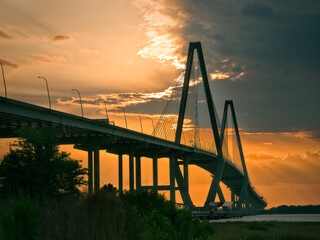 Naklejka premium Sunset over Harbor Bridge, Charleston, South Carolina.