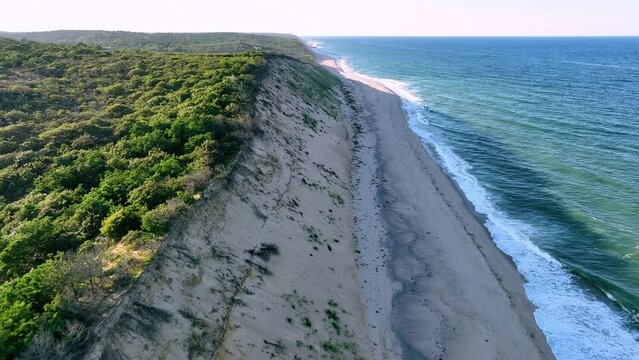 Passing over sand dunes and Cahoon Beach on the Atlantic Ocean at Cape Cod.