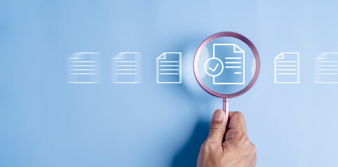 Fototapeta premium business, document, management, file, corporate, information, laptop, folder, professional, paper. close up to hand, hold magnifier to search file to management. document is important too business.